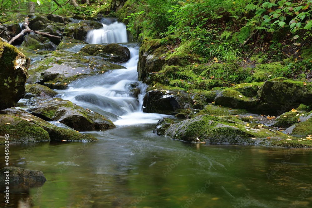 Franceville mount Megantic SEPAQ area. Long exposure small waterfall. Lots of rocks covered with green moss. Franceville mount Megantic SEPAQ area. Long exposure small waterfall. Lots of rocks covered with green moss.