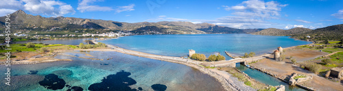 The famous canal of Elounda with the ruins of the old bridge, Crete, Greece. © gatsi