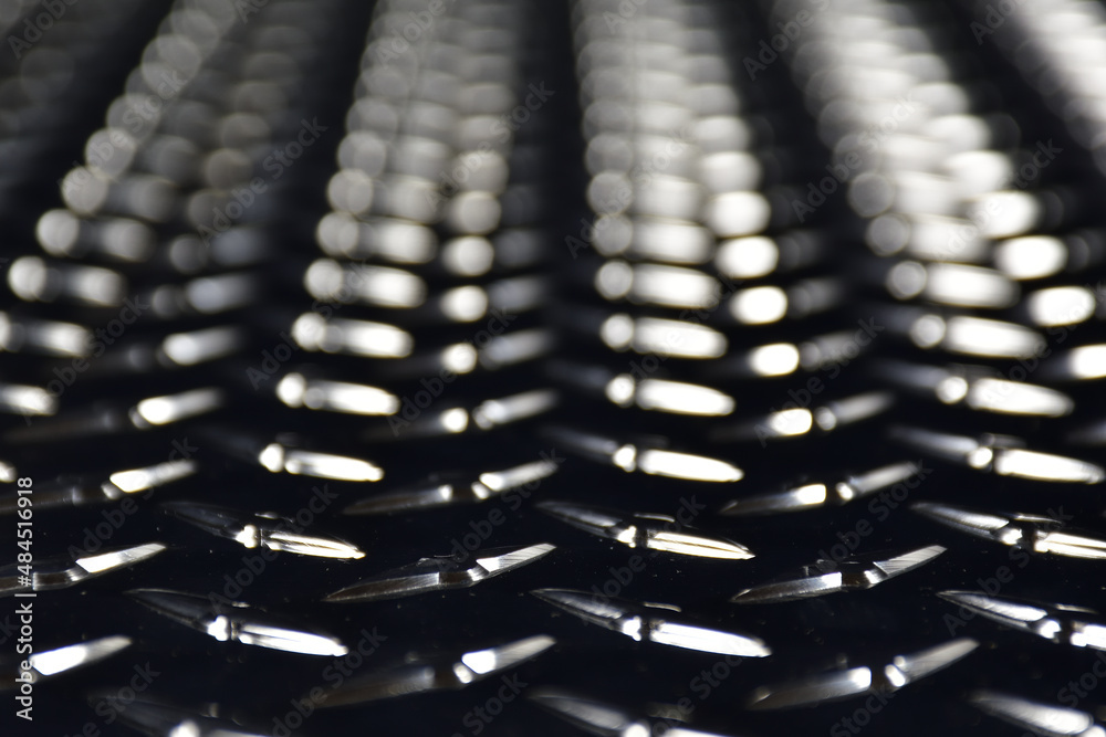Obraz premium Checker plate from low angle. Diamond plate texture.