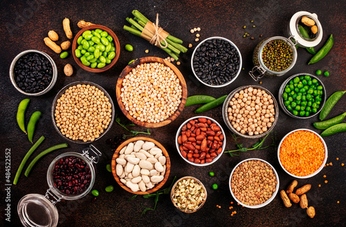 Fototapeta Naklejka Na Ścianę i Meble -  Legumes, beans and sprouts. Dried, raw and fresh, top view. Red kidney beans, lentils, mung beans, chickpeas, soybeans, edamame, green peas, Healthy, nutritious, diet food, vegan protein