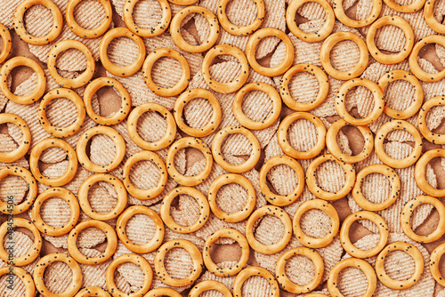 Background of savory mini pretzels with poppy top view  flat lay