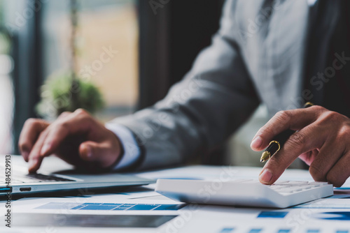 Εκτύπωση καμβά bookkeeper or financial inspector hands calculate making a report, calculating or checking balance