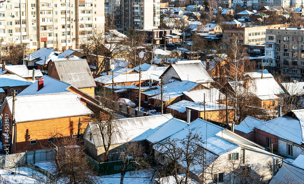 Fototapeta premium City street with houses covered with snow