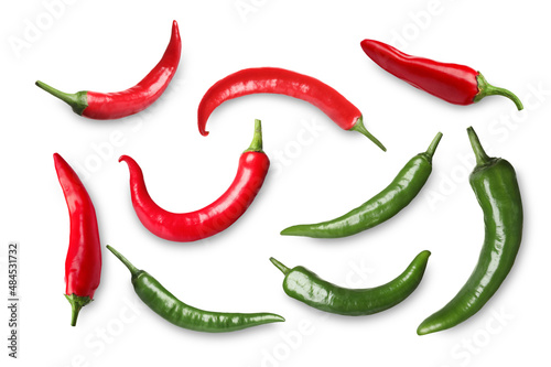 Set with red and green hot chili peppers on white background