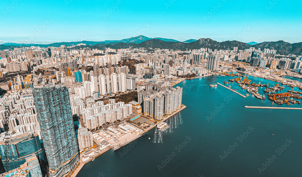 Panoramic aerial view of Hong Kong city in Orange and Teal  color tone