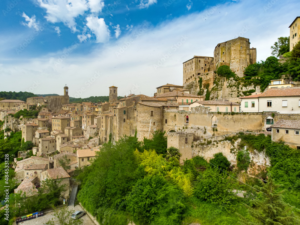 Aerial view of Sorano, an ancient medieval hill town hanging from a tuff stone over the Lente River.