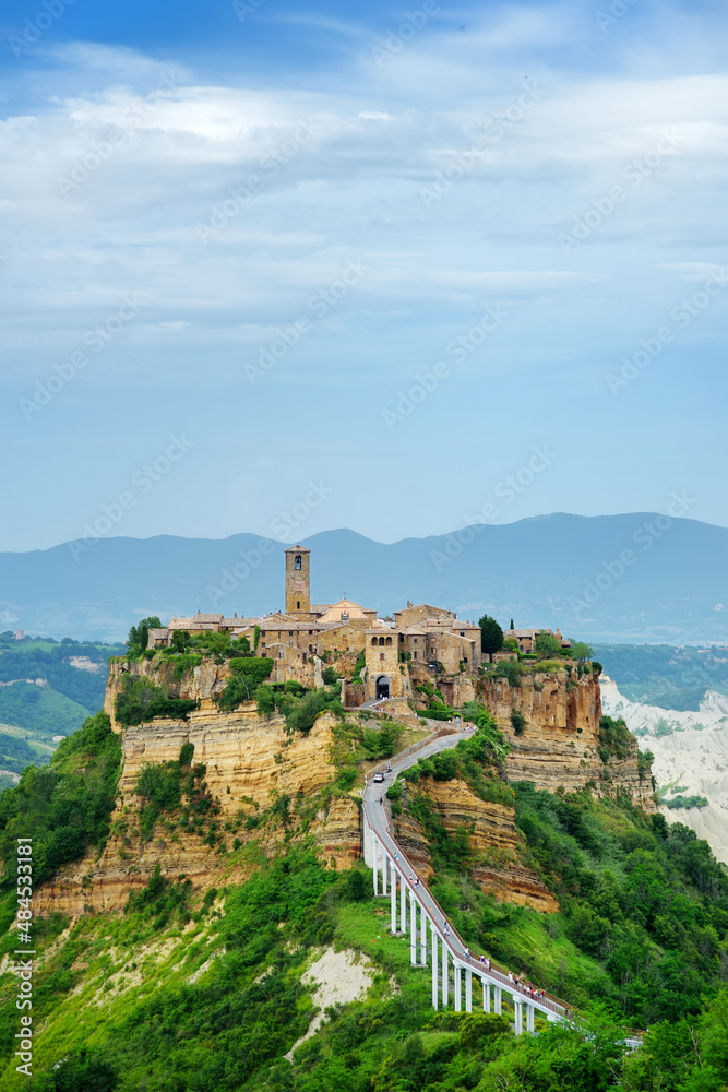 Summer evening view of famous Civita di Bagnoregio town, beautiful place located on top of a volcanic tuff hill overlooking the Tiber river valley