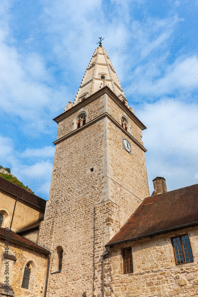 Village of Baume-les-Messieurs in the Jura in France. Abbaye Saint-Pierre de Baume, the facade of the 15th century church Village of Baume-les-Messieurs in the Jura in France. Abbaye Saint-Pierre de Baume, the facade of the 15th century church