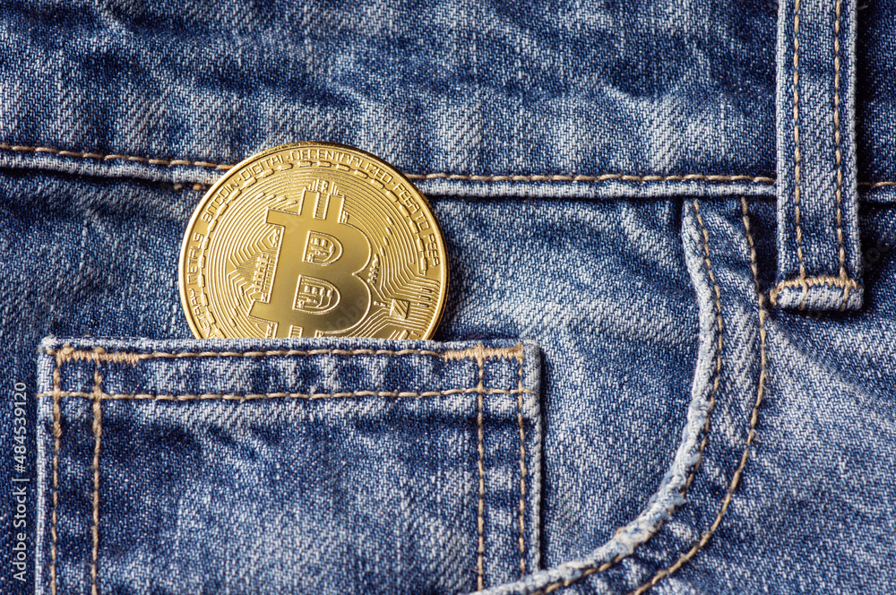 Bitcoin in jeans trousers bag, The concept of an investment of bitcoin and cryptocurrency Bitcoin in jeans trousers bag, The concept of an investment of bitcoin and cryptocurrency