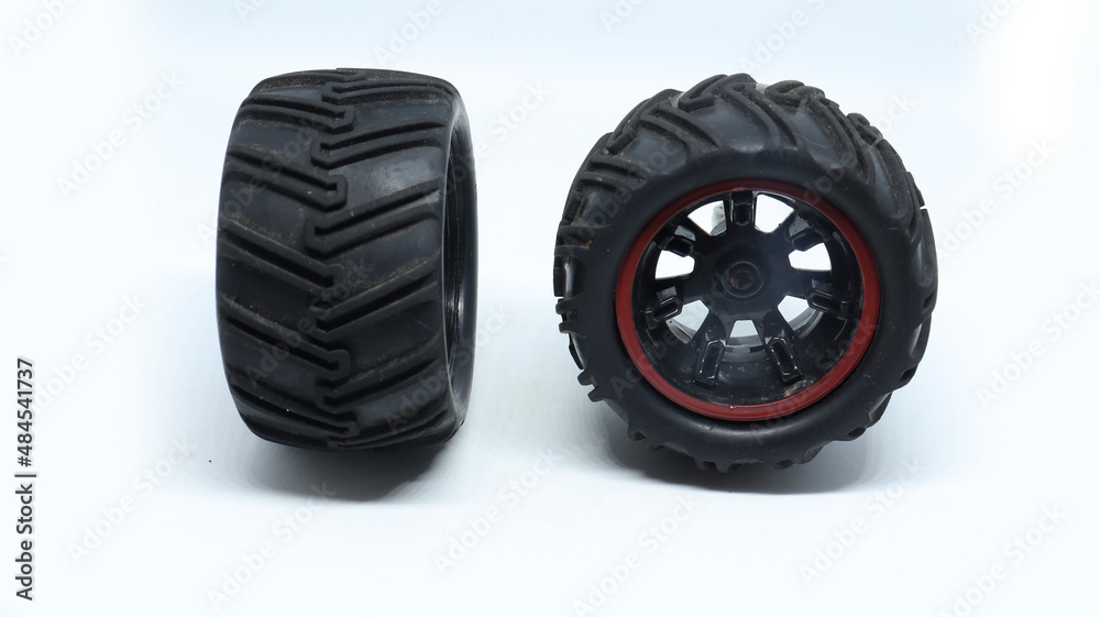 two black toy tire with white background
