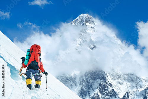 Mountaineer reaches the summit of mountain peak. National Park, Nepal.
