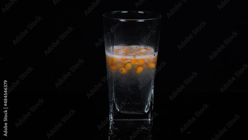 Lemonade. Sparkling water in a glass with mint and sea buckthorn Lemonade. Sparkling water in a glass with mint and sea buckthorn
