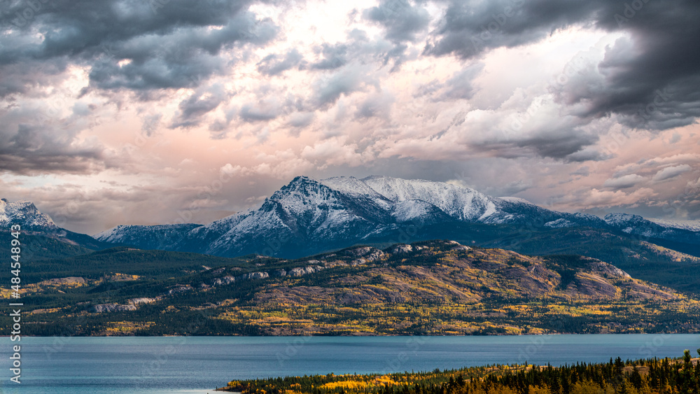 Stunning fall view at the start of winter with snow capped mountains in September with panoramic landscape scenic scene. 