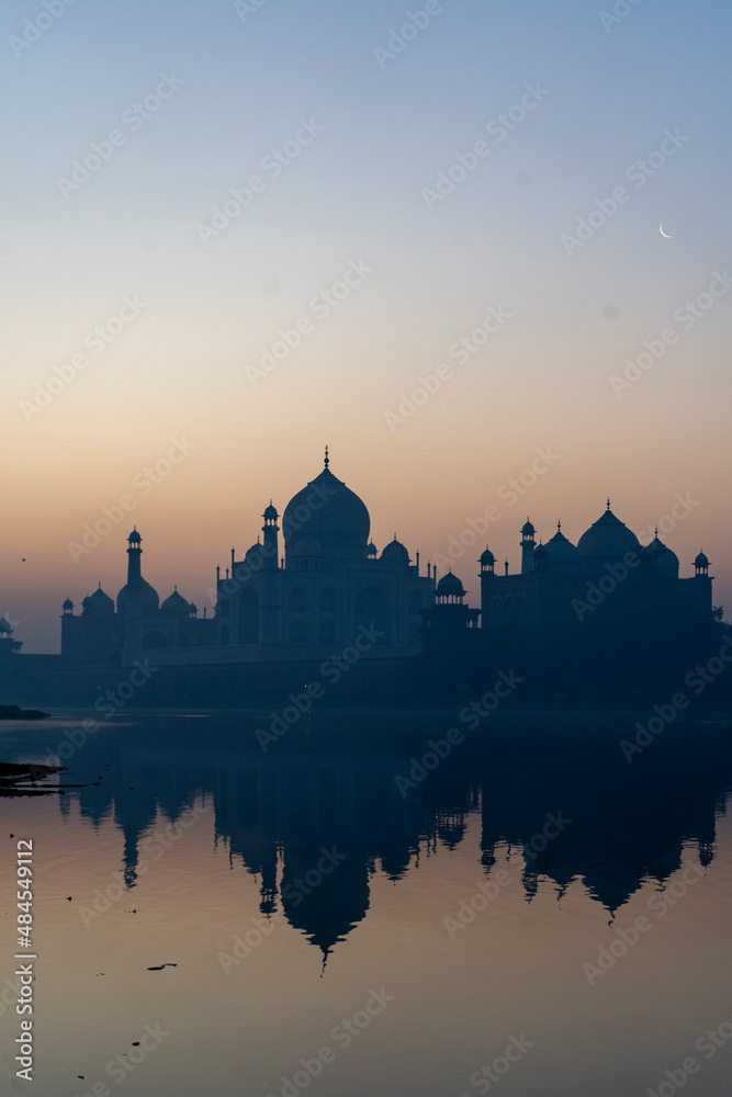 aj Mahal mausoleum reflected in Yamuna river - Agra, Uttar Pradesh, India