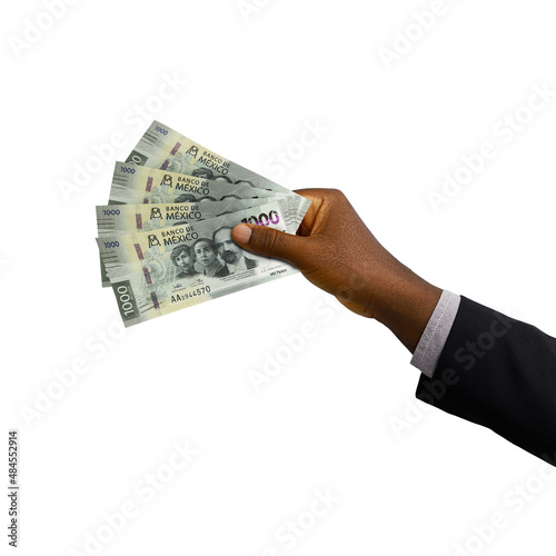 Black hand with suit holding 3D rendered Mexican peso notes isolated on white background