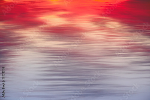 Pink wavy sky and clouds look like water with ripples. Abstract nature backgrounds