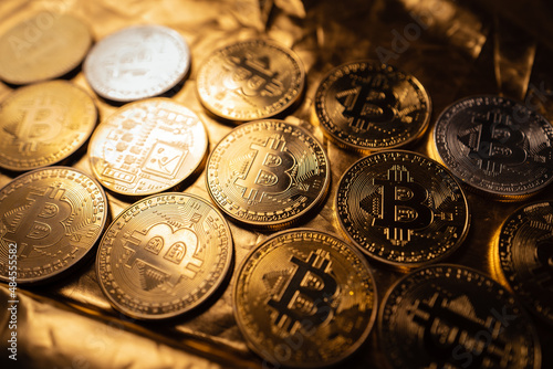 Bitcoin Cryptocurrency Gold Coins in the golden background