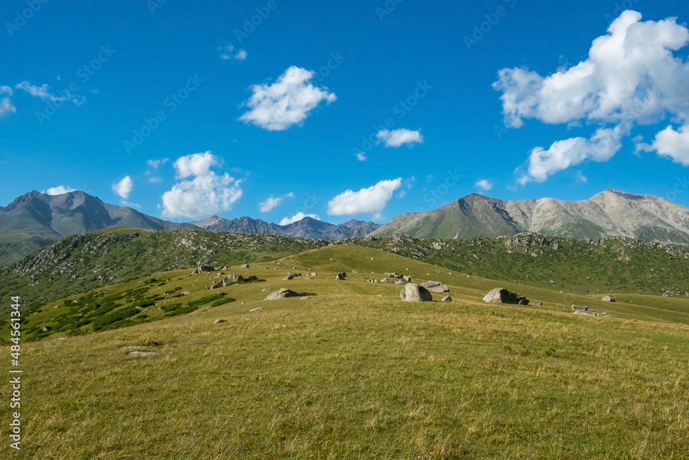 Beautiful mountain stone valley landscape with cloudy sky background.