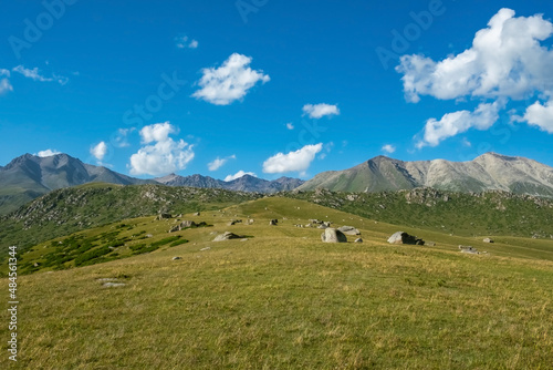 Beautiful mountain stone valley landscape with cloudy sky background.