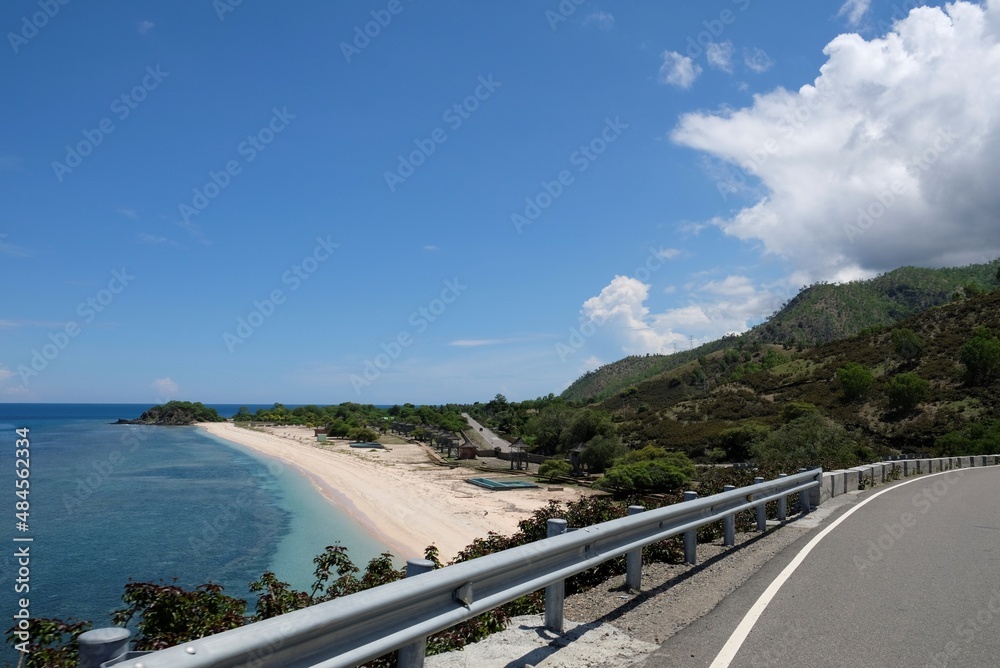 Beautiful scenery of One Dollar Beach located between Dili and Manatuto, Timor Leste. White sandy beach landscape. Beautiful scenery of One Dollar Beach located between Dili and Manatuto, Timor Leste. White sandy beach landscape.