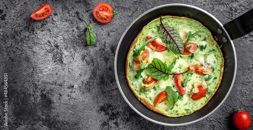 Frittata with fresh vegetables and cheese. Italian omelet in the pan. Keto, ketogenic lunch. banner, menu, recipe place for text, top view photo