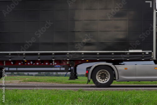 moving unfocused truck on the countryside road