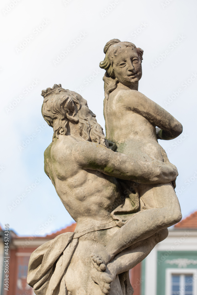 Obraz premium Proserpina fountain in front of the the historical town hall to Poznan, Poland, ancient statue in the old town. Landmarks in the city. Details.