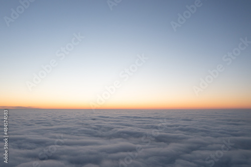 Wonderful morning landscape. The sun rises over the fog. Sunset over the clouds.