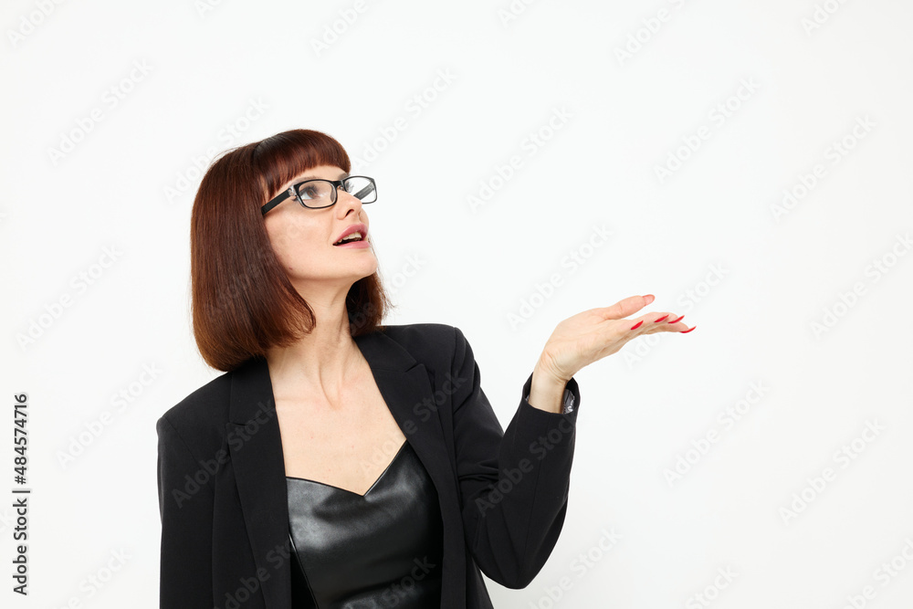 attractive woman posing with glasses a leather suit black jacket isolated background