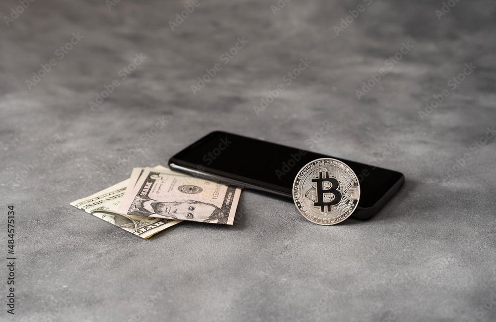 Bitcoin to USD. bitcoin coin, dollar, phone. Crypto Investing Bitcoin to USD. bitcoin coin, dollar, phone. Crypto Investing