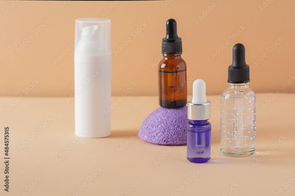 Beauty, spa and wellness concept. Facial cosmetic products, konjac sponge on a beige background. Health and medicine concept, beauty and selfcare. Front view