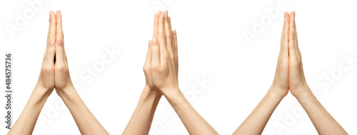 Hands folded in namaste prayer isolated on white. Female hands pray show hope and religion. Indian or yoga gesture fingers. photo