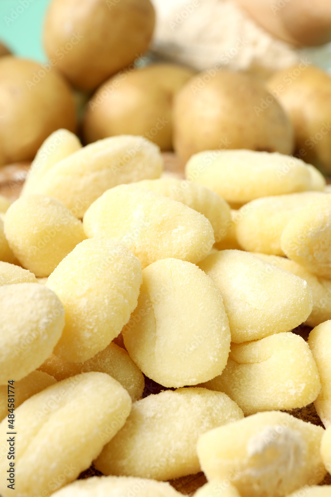 Concept of cooking with raw potato gnocchi, close up Concept of cooking with raw potato gnocchi, close up