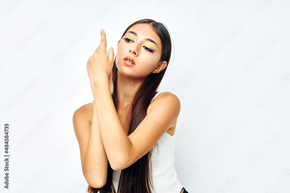 portrait pretty woman long hair cosmetics posing light background unaltered portrait pretty woman long hair cosmetics posing light background unaltered