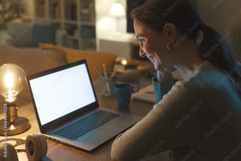 Woman connecting with her laptop at home