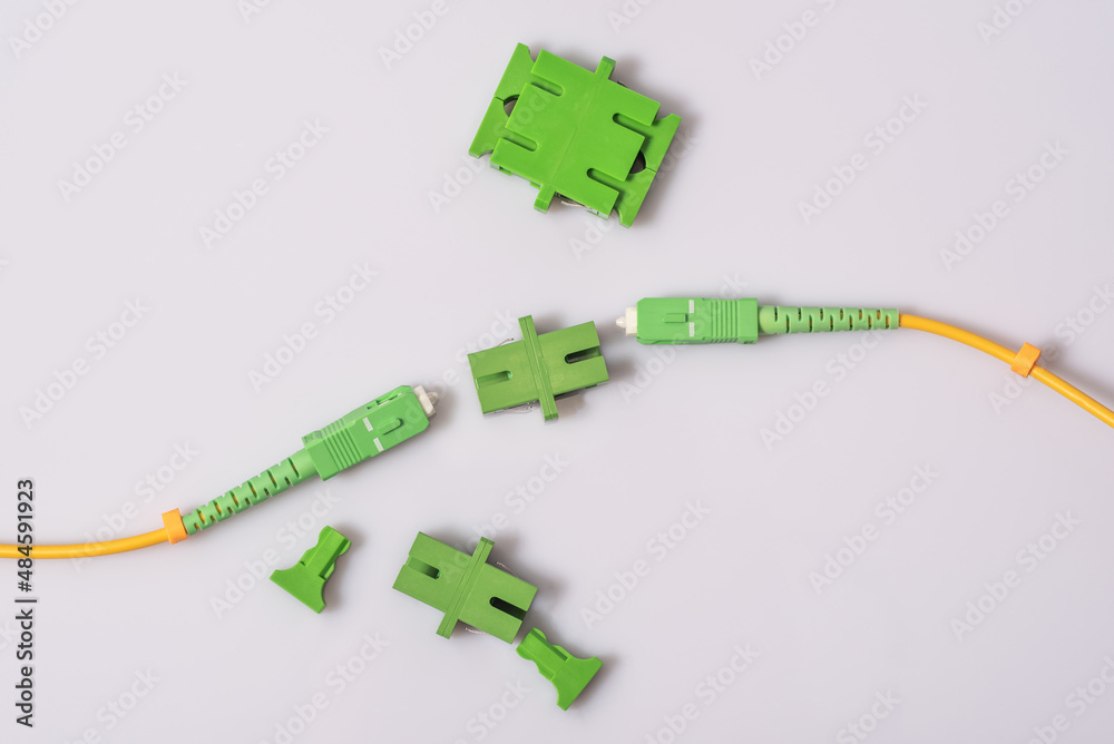 Optical patch cords with an SC-APC connector between them adapter ...