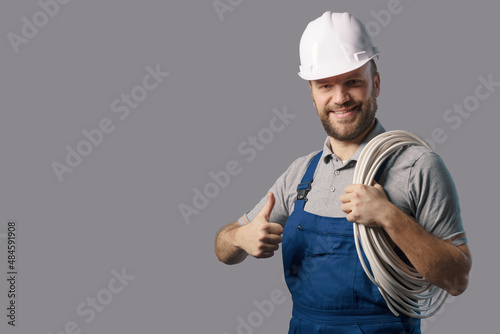Professional electrician giving a thumbs up