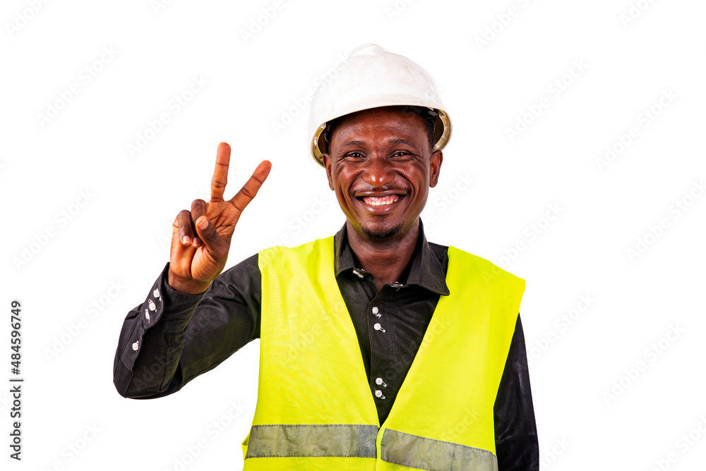 young man construction engineer riding the victory sign smiling. young man construction engineer riding the victory sign smiling.