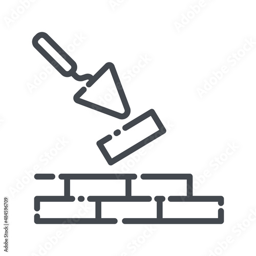 Putty knife and brick wall line icon isolated