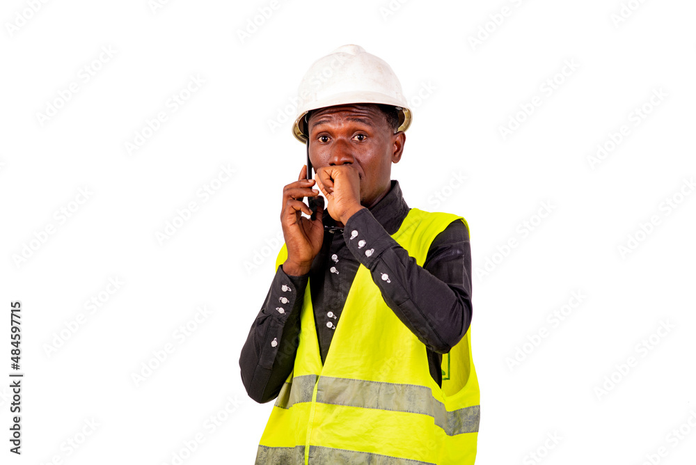 portrait of a construction engineer talking on cell phone, astonished. portrait of a construction engineer talking on cell phone, astonished.