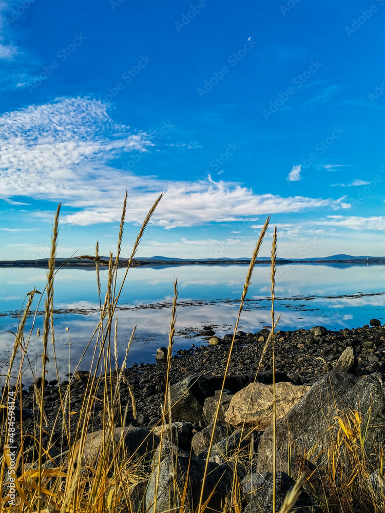 The White Sea coast on a sunny day. The sun's rays. Karelia. 2021. Russia.