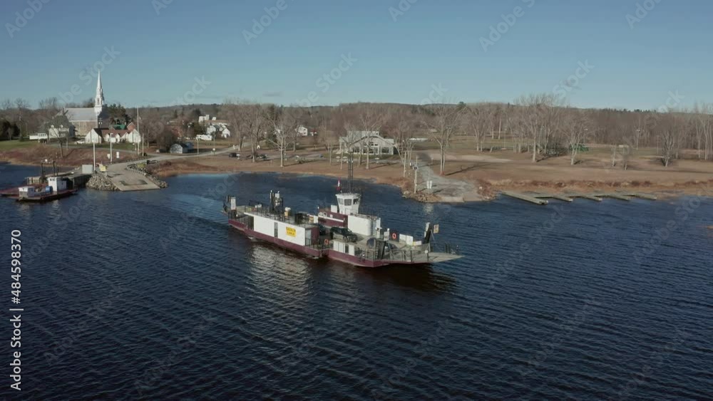 Aerial view of Quyon Ferry navigating in the Ottawa river transporting cars Aerial view of Quyon Ferry navigating in the Ottawa river transporting cars