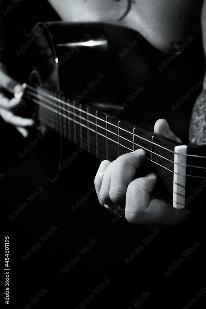 Fototapeta premium Man playing guitar and singing shirtless