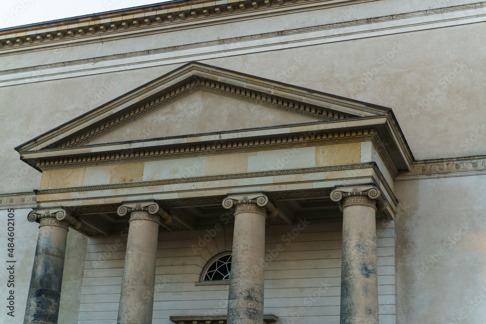 Old building facade, made in a Roman and Greek style.