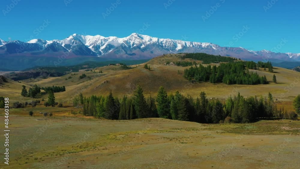 fields and mountains with snow-capped peaks fields and mountains with snow-capped peaks