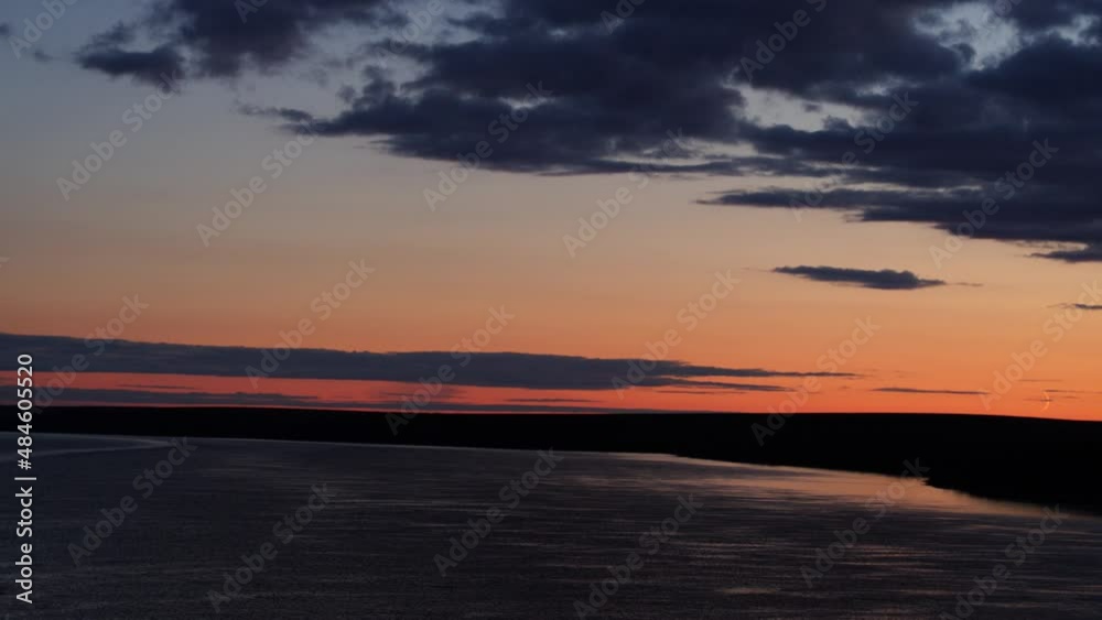Aerial Idyllic Shot Of Tranquil River Against Dramatic Orange Sky - Saint Mary's, Alaska Aerial Idyllic Shot Of Tranquil River Against Dramatic Orange Sky - Saint Mary's, Alaska