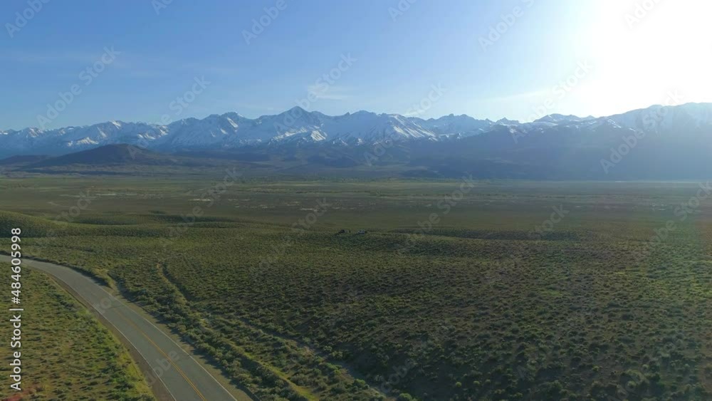 Aerial Forward Descending Beautiful View Of Snow Covered Mountains Against Clear Sky - Bishop, California Aerial Forward Descending Beautiful View Of Snow Covered Mountains Against Clear Sky - Bishop, California