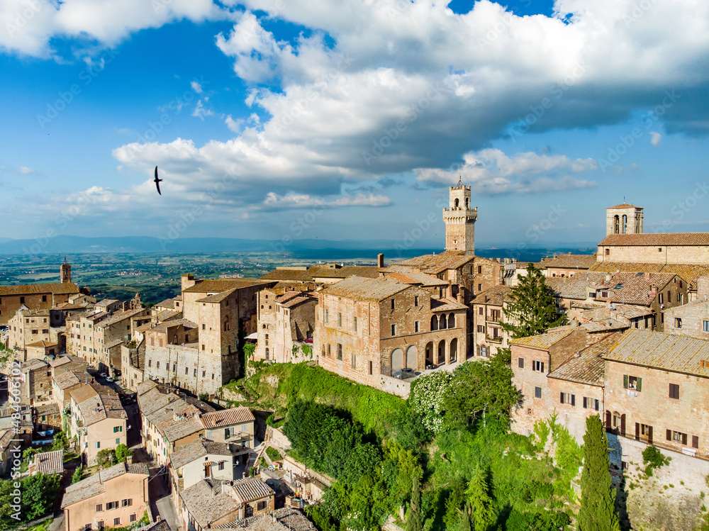 Aerial summer day view of Montepulciano town, located on top of a limestone ridge surrounded by vineyards. Vino Nobile wine territory, known worldwide for its wine and food tours.