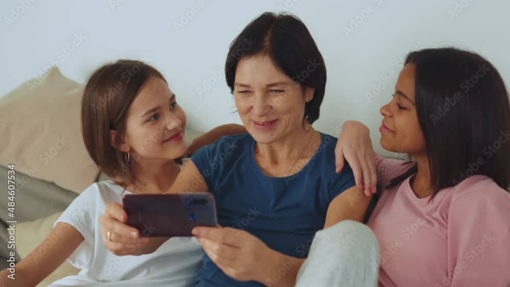 Handsome multiethnic family doing selfie on phone at home Handsome multiethnic family doing selfie on phone at home