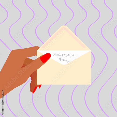 The hand is holding an envelope.
Envelope with a letter.